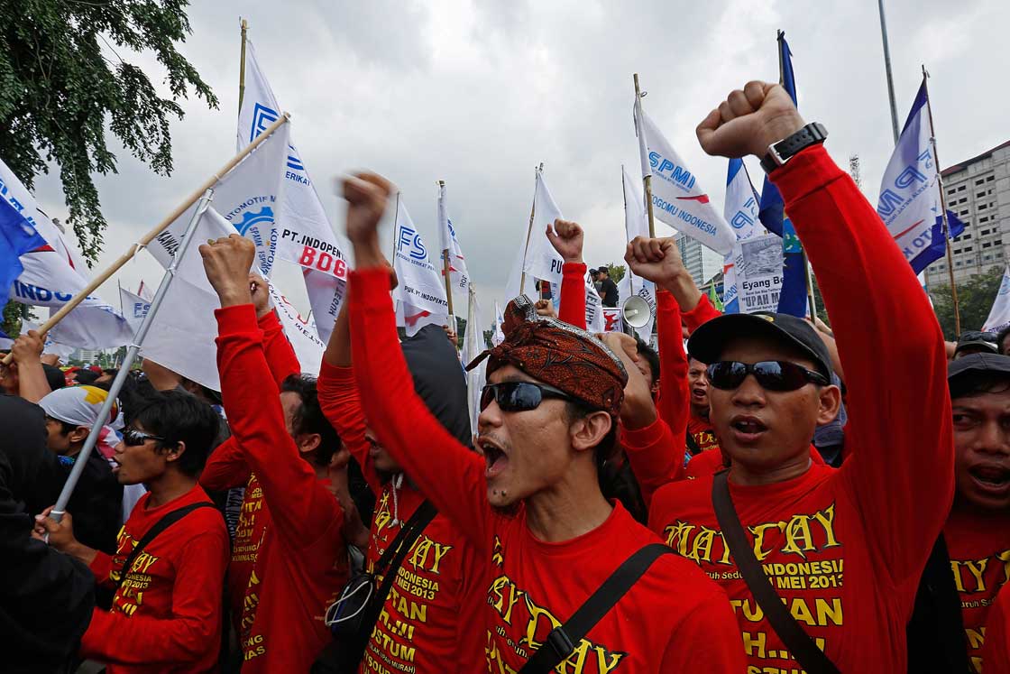 May Day demonstrators shout slogans in front of the Presidential Palace during a labour demonstration on May 1, 2013 in Jakarta, Indonesia.  