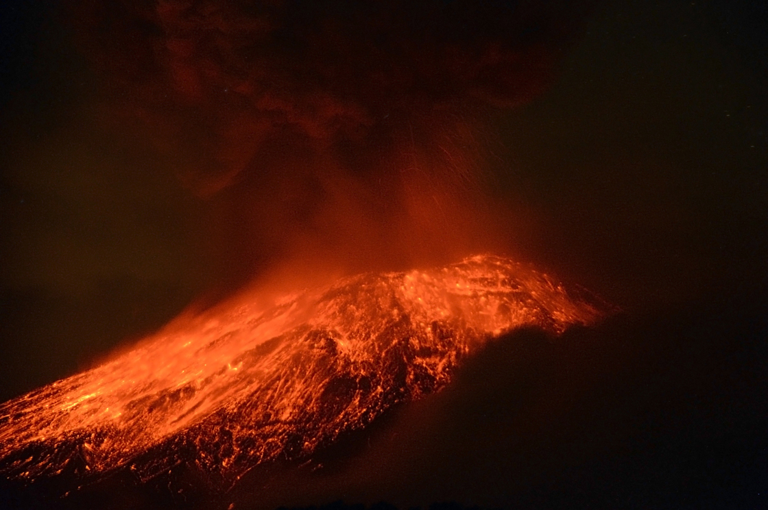 Lava flows from the Popocatepetl volcano after an eruption, seen from Tlamacas, Mexico, early Wednesday, May 15, 2013. 