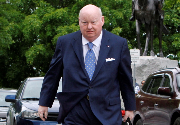 Senator Mike Duffy makes his way to the Senate on Parliament Hill, Tuesday, May 28, 2013 in Ottawa. What began as a probe into Senator Mike Duffy's primary residence has morphed this week into something much more explosive. THE CANADIAN PRESS/.
