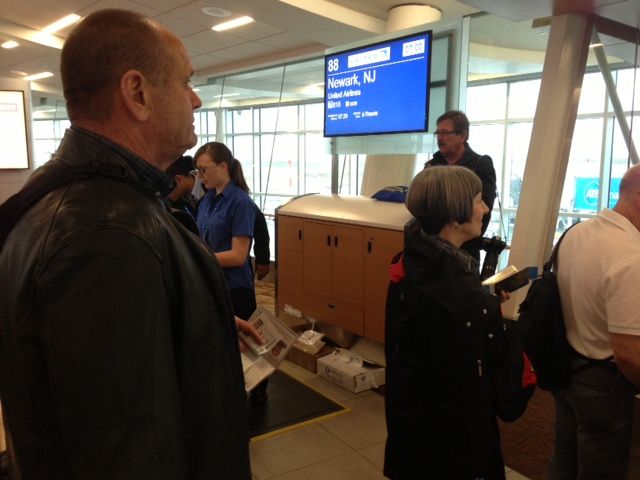 Travellers dealing with cancellations and delays at Edmonton airport - image