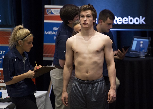 Jonathan Drouin gets measured during the NHL Scouting Combine in Toronto.