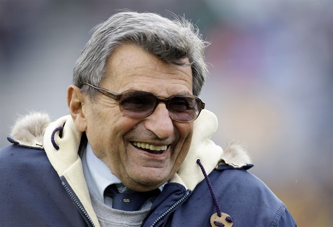 FILE - In this Oct. 17, 2009 file photo, Penn State coach Joe Paterno smiles as he walks the field before an NCAA college football game against Minnesota in State College, Pa.