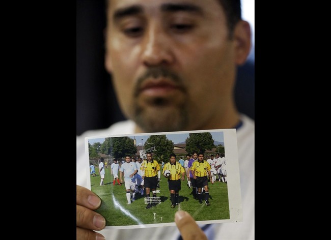 In this Thursday, May 2, 2013 file photo, Jose Lopez points to an undated photo of Riccardo Portillo, center, his brother-in-law, following a news conference , at Intermountain Medical Center, in Murray, Utah. 