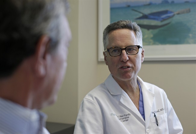Prostate cancer patient Dean Smith, left, a retired marketing executive, meets with Dr. Peter Carroll, right, at the UCSF Medical Center in San Francisco on Thursday, May 2, 2013.