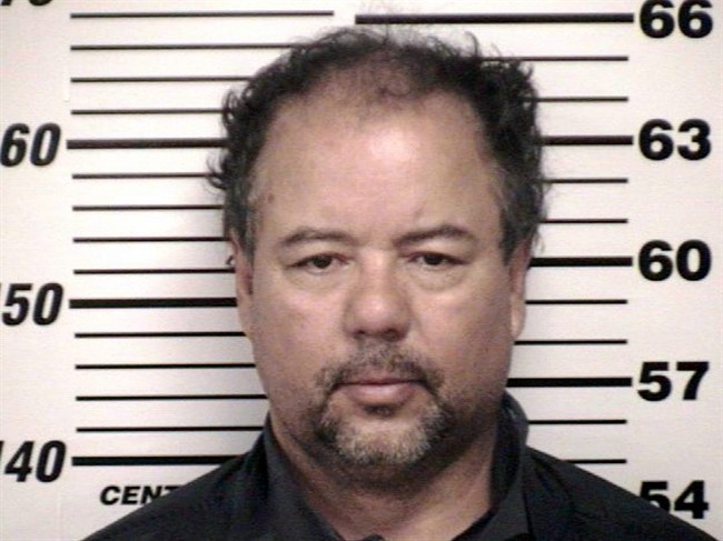 This image provided by the Cuyahoga County Sheriff's office shows the Cuyahoga County Corrections Center booking photo of Ariel Castro, 52, after he was ordered to be held on $8 million bail Thursday, May 9, 2013, in Cleveland.