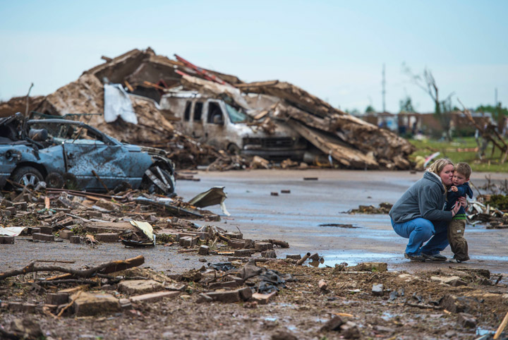 Heather Schmidt kisses her two year old son Zachary Schmidt,after surveying the tornado damage of her aunt and uncle’s home on May 21, 2013 in Moore, Oklahoma. Getty Images