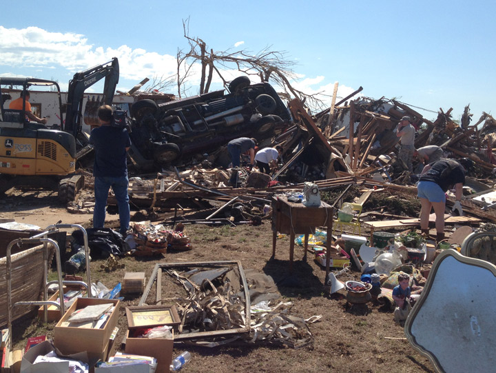 Residents in Moore, Oklahoma try to find their belongings two days after a massive tornado destroyed homes and killed at least two dozen people. 