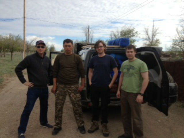 Paul Johnson (left) and Nicolas Bock (2nd fr. R) with their driver and fixer in Kazakhstan.