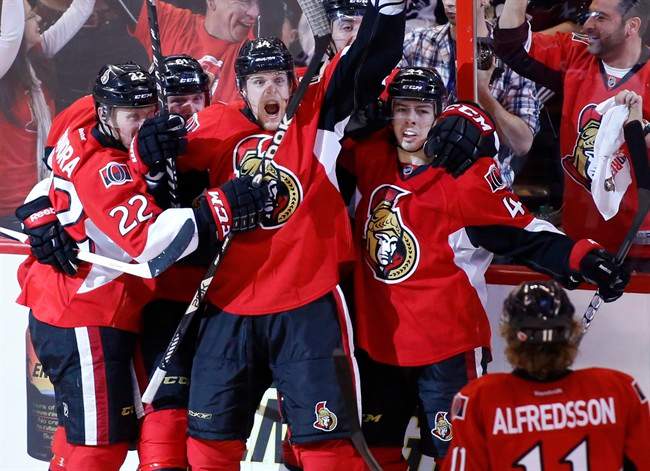Ottawa Senators Erik Condra, Andre Benoit, Colin Greening, Jean-Gabriel Pageau, and Daniel Alfredsson celebrate after Greening scores the winning goal against the Pittsburgh Penguins during the second overtime period of game four of their Stanley Cup Eastern Conference semi-final NHL hockey game at Scotiabank Place in Ottawa on Sunday, May 19, 2013. 