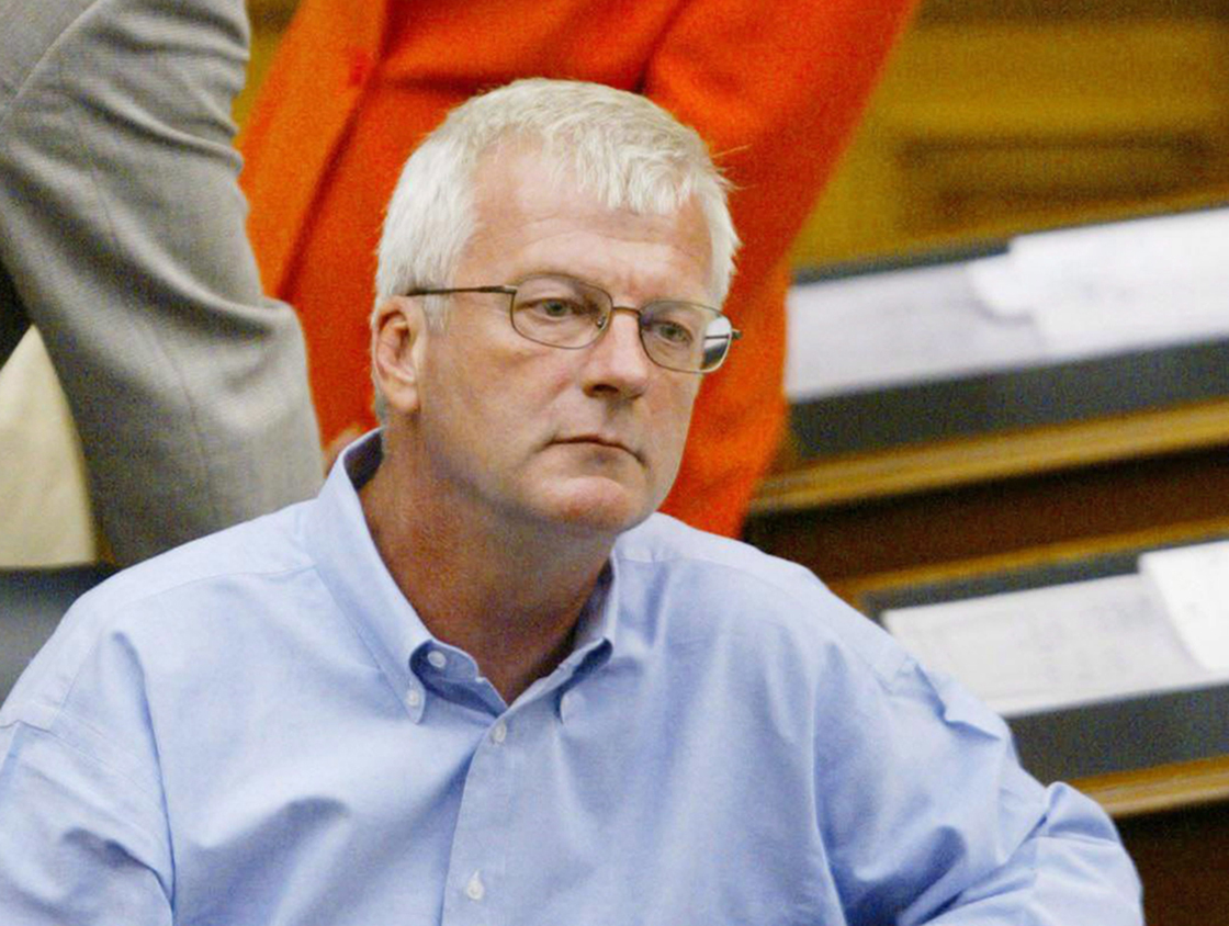 Ontario NDP house leader Peter Kormos sits in his chair at Queen's Park in Toronto, July 11, 2002. 