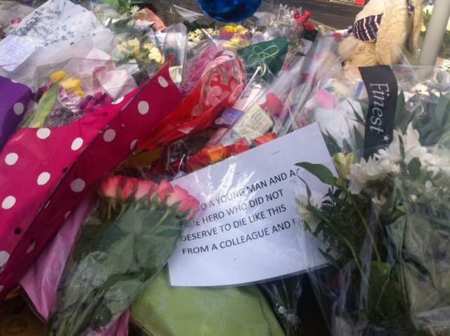 A note left where British soldier Lee Rigby was murdered on Wednesday reads "To a young man and a true hero who did not deserve to die like this." One of the suspects in the brutal murder has been linked to a banned Islamic extremist group.