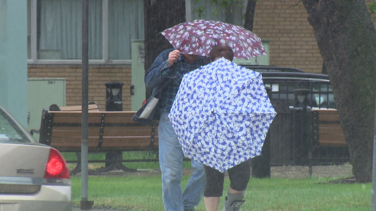 Winnipeggers battle rainy weather in this file photo.