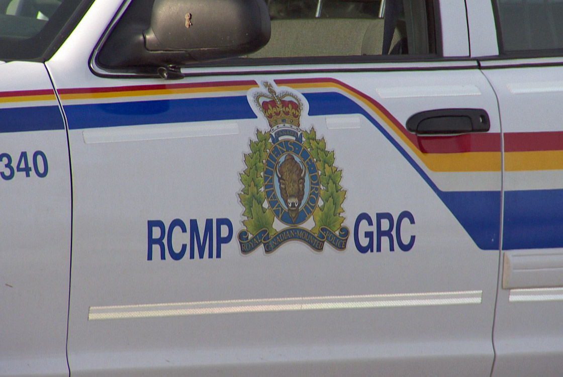 The logo on the front door of an RCMP patrol car.