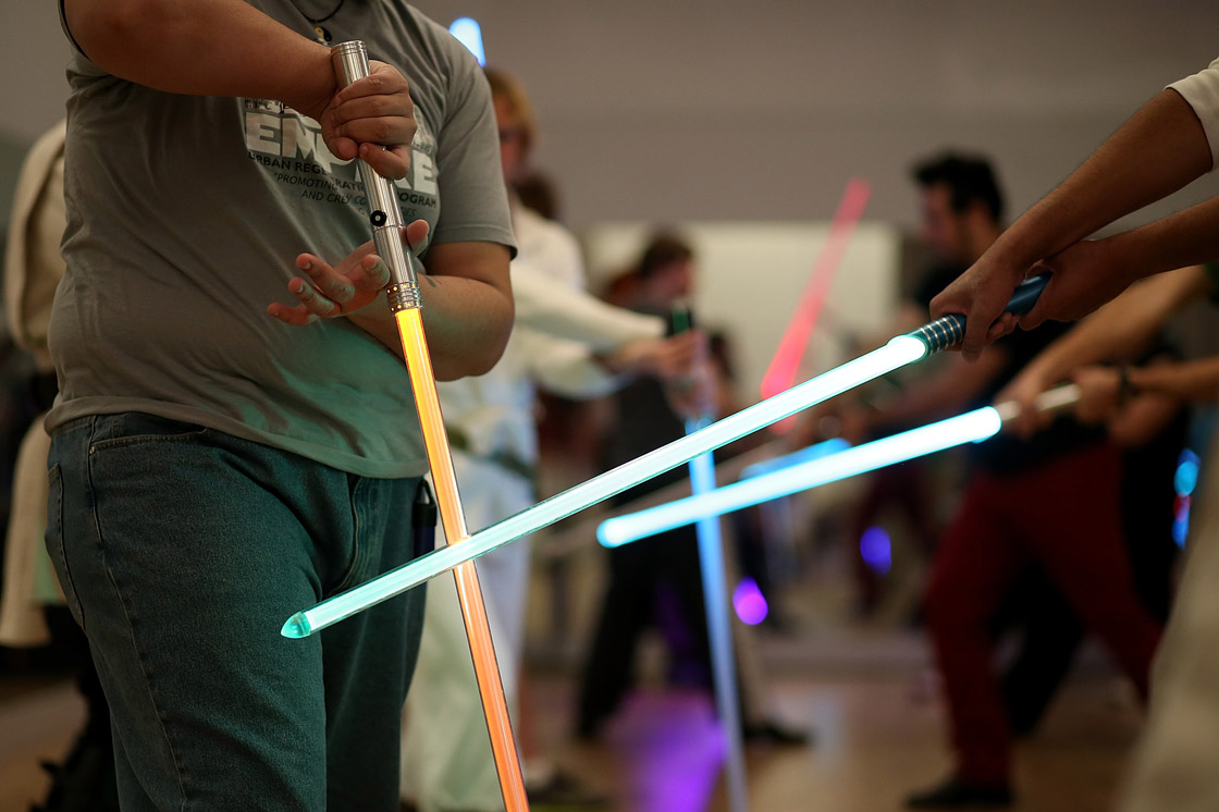 Students perform combat moves using lightsabers during a Golden Gate Knights class in saber choreography on February 24, 2013 in San Francisco, California.