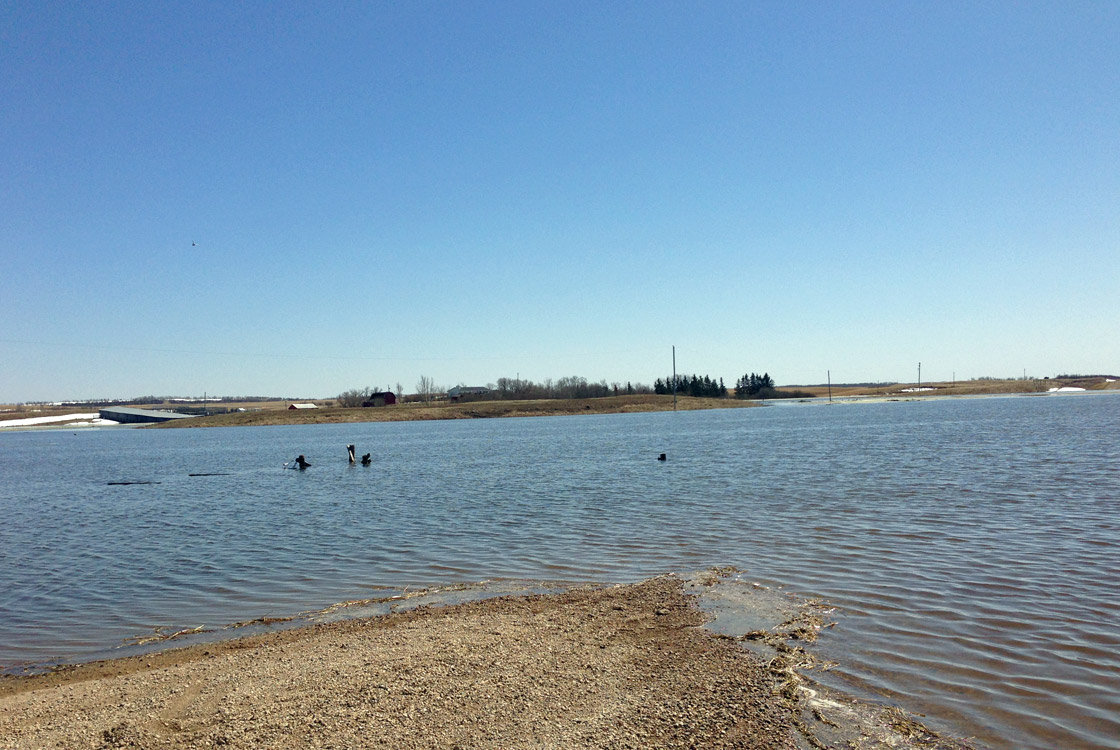 A washed out road and submerged land in the R.M. of Fish Creek on Monday. The R.M. of Humboldt has now declared state of emergency due to a flood threat.
