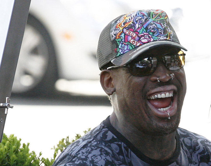 Dennis Rodman has a laugh during lunch on a patio in Toronto in this file photo.