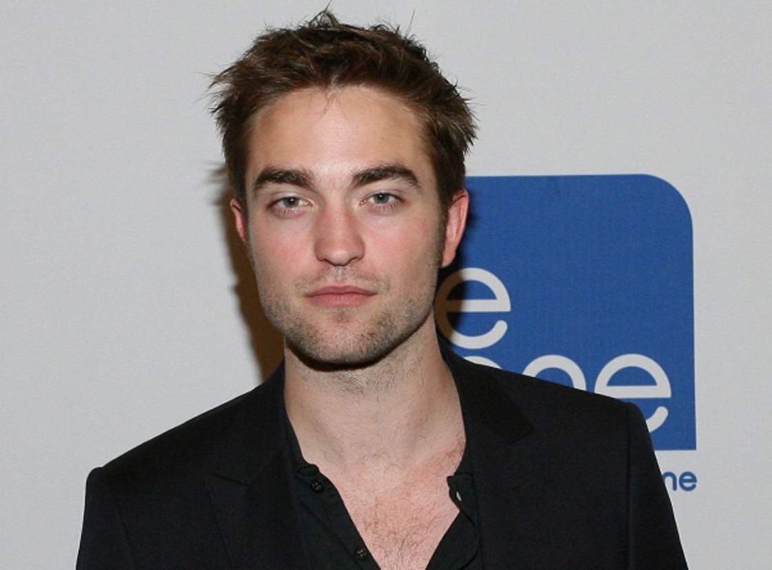 Robert Pattinson poses while promoting 'Cosmopolis' in Toronto in 2012.