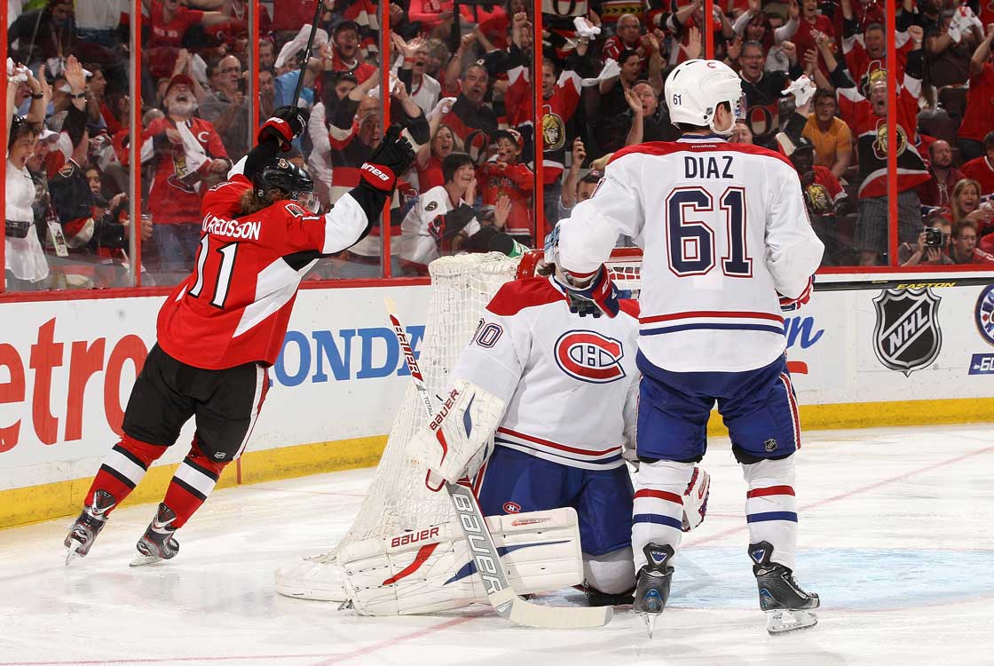 Daniel Alfredsson of the Ottawa Senators celebrates an overtime goal against Peter Budaj of the Montreal Canadiens as Raphael Diaz of the Montreal Canadiens looks on, in Game Four of the Eastern Conference Quarterfinals during the 2013 NHL Stanley Cup Playoffs, at Scotiabank Place, on May 7, 2013 in Ottawa.  