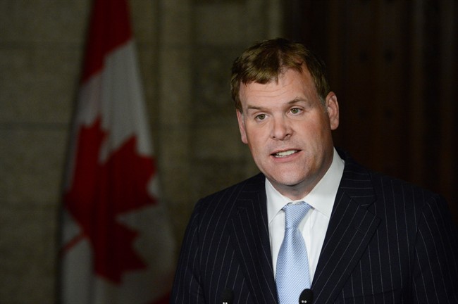 Foreign Affairs Minister John Baird holds a news conference in Ottawa, Wednesday, May 29, 2013. Canada is banning exports to and imports from Iran and adding 30 individuals and 82 entities to an economic blacklist.