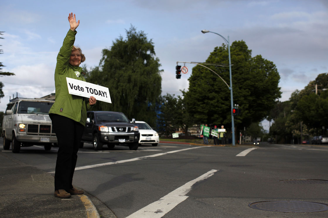 BC Green Party leader Jane Sterk and volunteers sign wave along Oak Bay Ave. and Fort St. in Victoria Tuesday May 14, 2013. Today British Columbians head to the polls to cast their vote for leaders in the 2013 provincial election. 