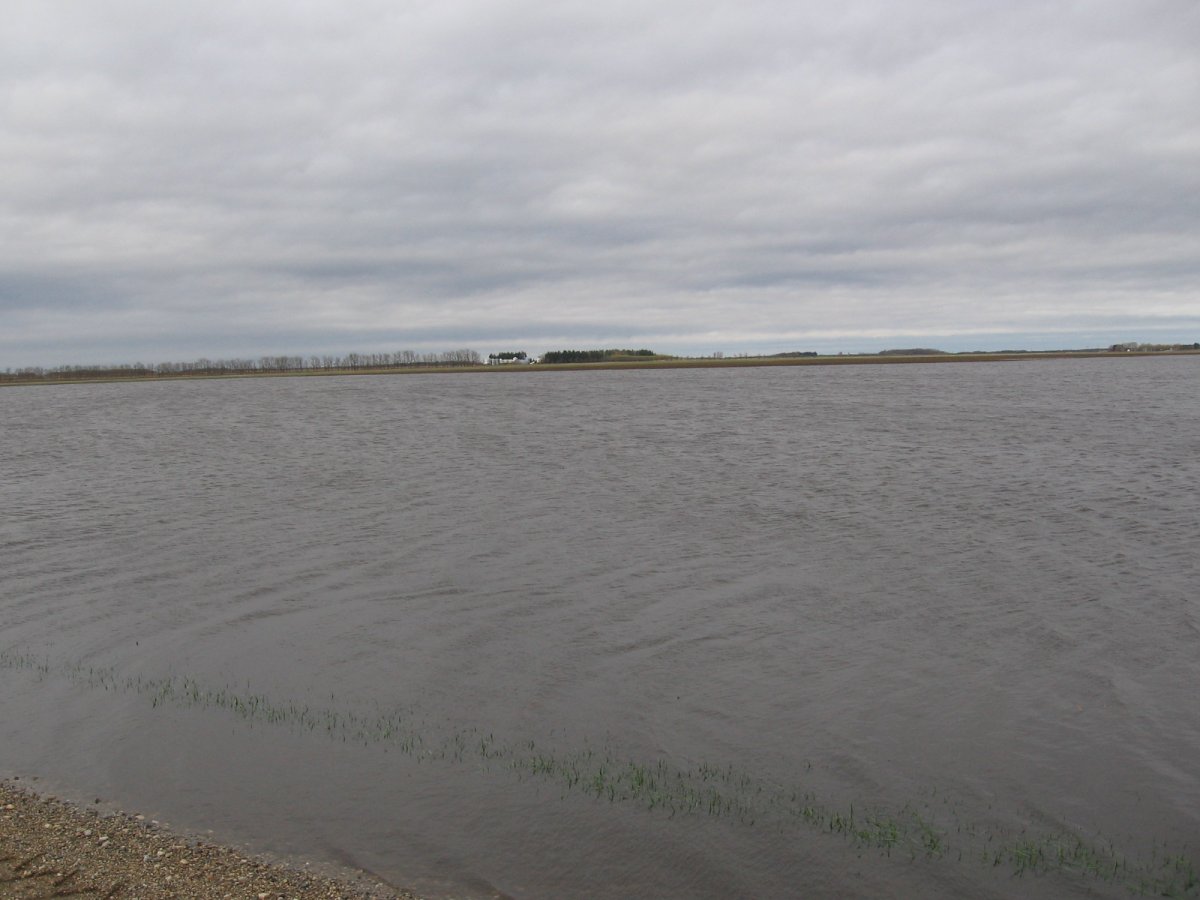 Farmland lies underwater at Thornhill, Man., after the area was drenched with rain over the weekend.