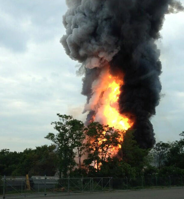 This photo provided by Kevin Lindemann, shows an explosion outside Baltimore on Tuesday, May, 28, 2013. Baltimore County fire officials say a train derailed in a Baltimore suburb on Tuesday and an explosion was heard in the area. A fire spokeswoman says the train derailed about 2 p.m. Tuesday in White Marsh, Md.