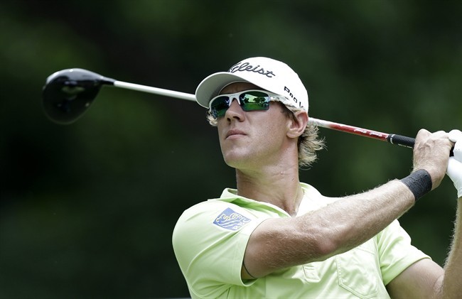 Graham DeLaet watches his tee shot on the second hole during the third round of the Colonial golf tournament Saturday, May 25, 2013, in Fort Worth, Texas. (AP Photo/LM Otero)