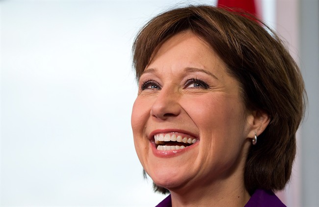 British Columbia Premier Christy Clark smiles during a news conference.
