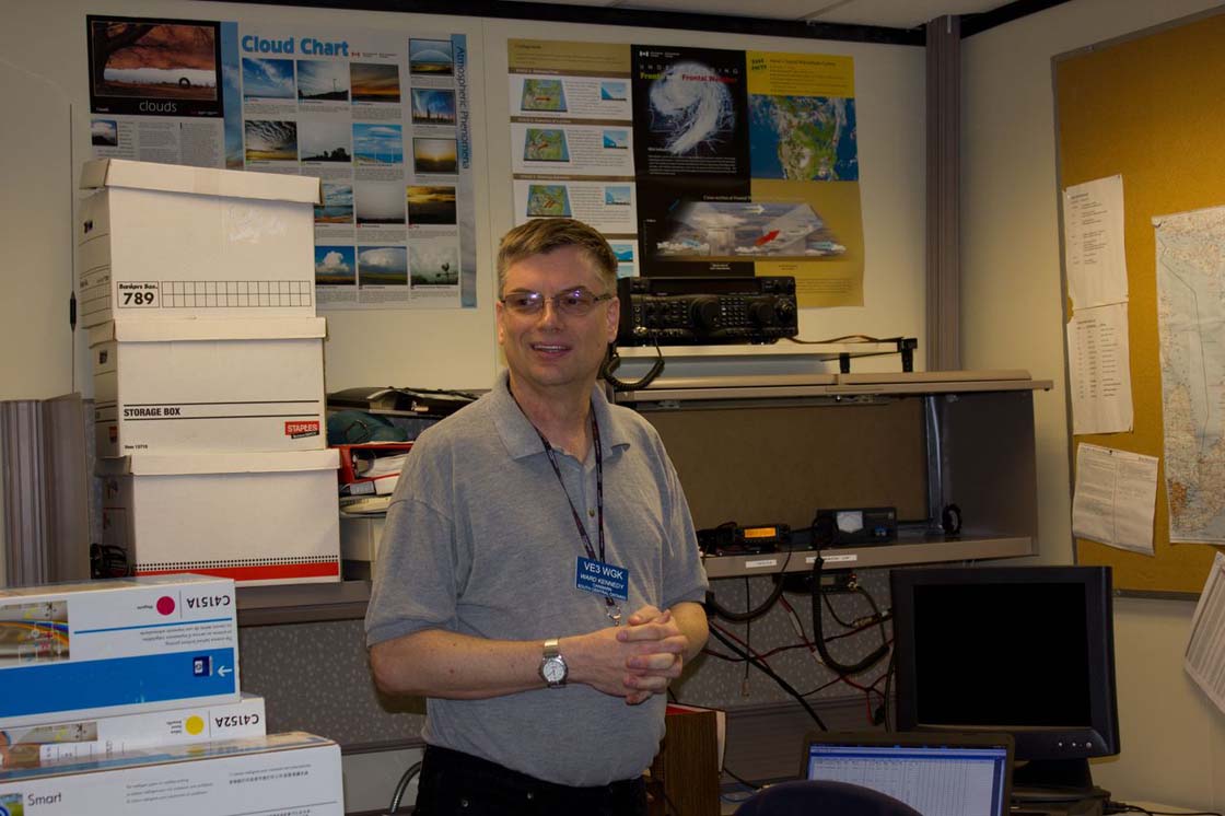 Ward Kennedy, a volunteer with CANWARN in the radio room at Environment Canada in Toronto