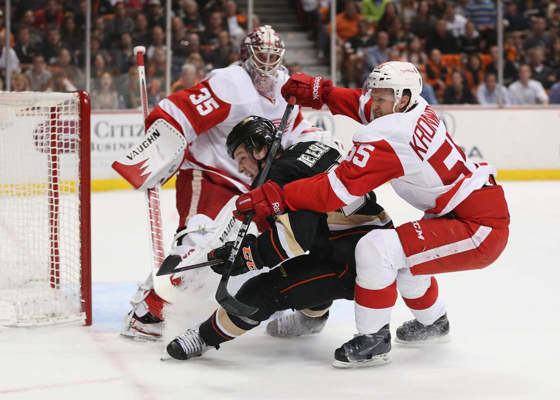 Matt Beleskey of the Anaheim Ducks is checked by Niklas Kronwall  of the Detroit Red Wings in the first period of Game Five of the Western Conference Quarterfinals during the 2013 NHL Stanley Cup Playoffs at Honda Center on May 8, 2013 in Anaheim, California. 