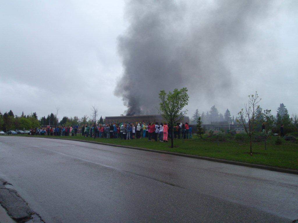 Southwest school evacuated after fire breaks out in bus - Calgary ...