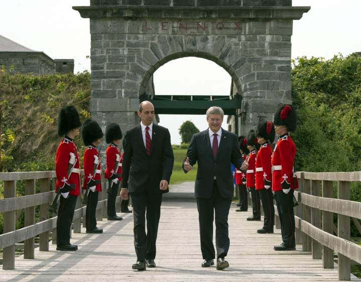 Prime Minister Stephen Harper, right, and Veteran's Affairs Minister Steven Blaney walk past an honour guard at Fort Lennox Friday, September 14, 2012 in Saint-Paul-de-L'ile-aux-Nois. Harper commemorated the war of 1812.