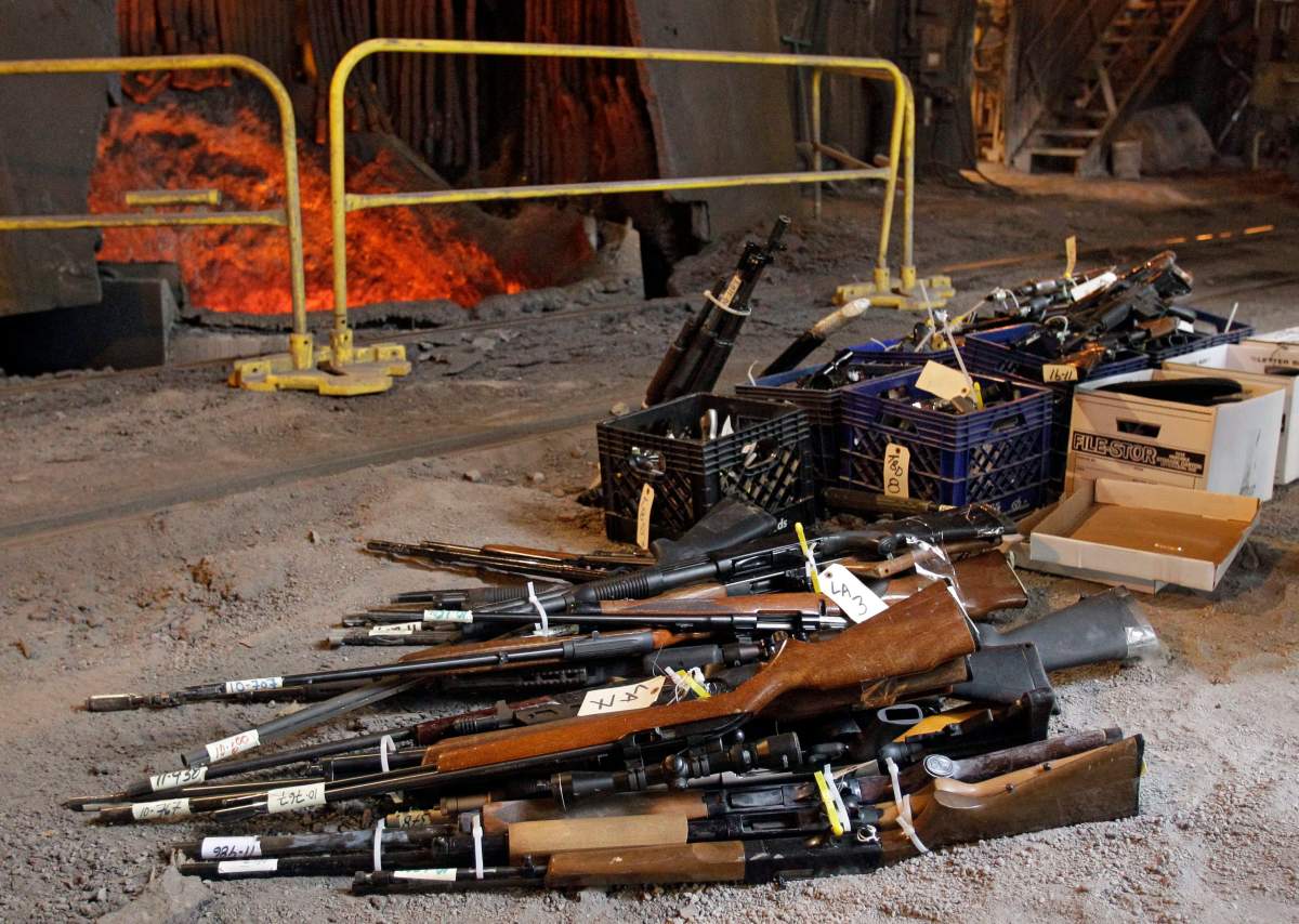 Firearms wait to be flung into a blast furnace and destroyed in Cleveland, Ohio in this 2011 file image. The end of the long gun registry means that more lost and stolen firearms are likely to be destroyed rather than traced to their owners, a veteran OPP firearms officer warns.