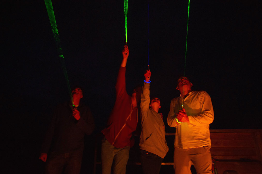 Astronomers use green lasers to point out stars and constellations during public outreach programs.