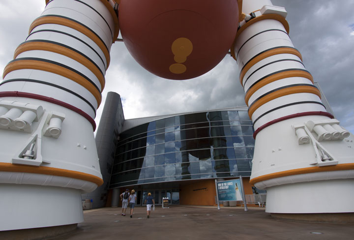 At the Kennedy Space Center Visitor Complex in Florida, a full-scale set of space shuttle twin solid rocket boosters and external fuel tank stand at the entrance to the 90,000-square-foot "Space Shuttle Atlantis" facility. 