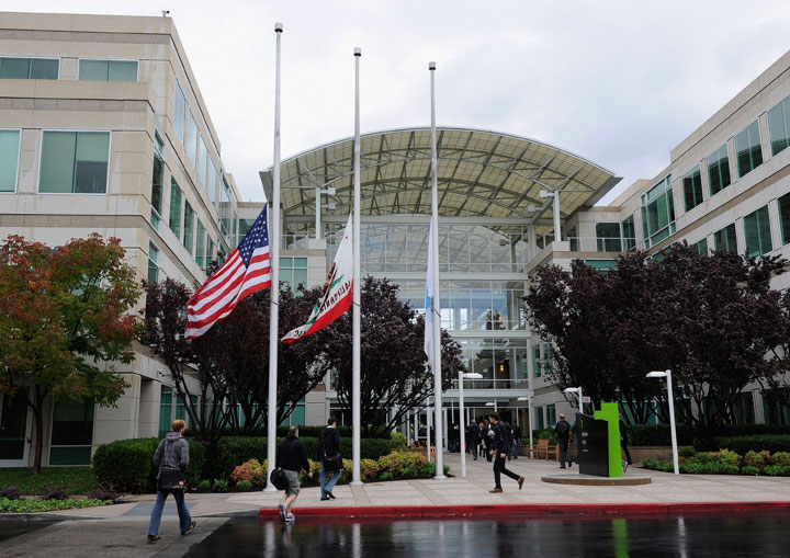 Apple employees arrive to work at Apple Headquarters in Cupertino, California.