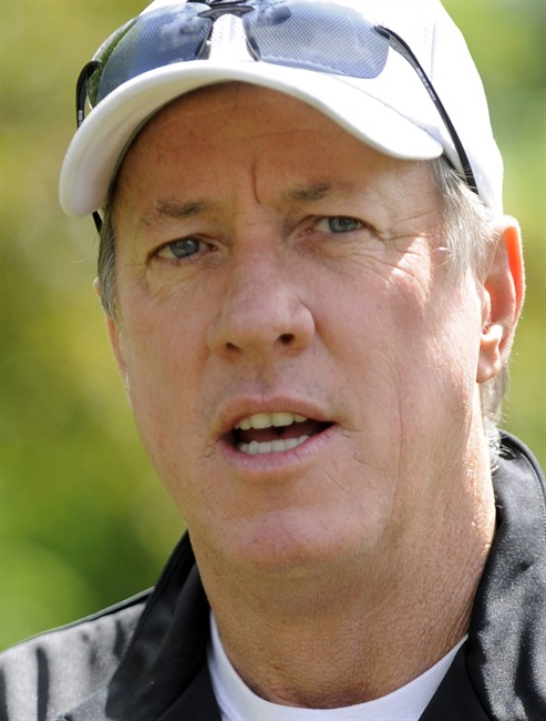 Jim Kelly talks to the media before a press conference in Batavia, N.Y. , Monday June 3, 2013. Kelly says he has been diagnosed with cancer in his upper jaw bone and will have surgery on June 7.