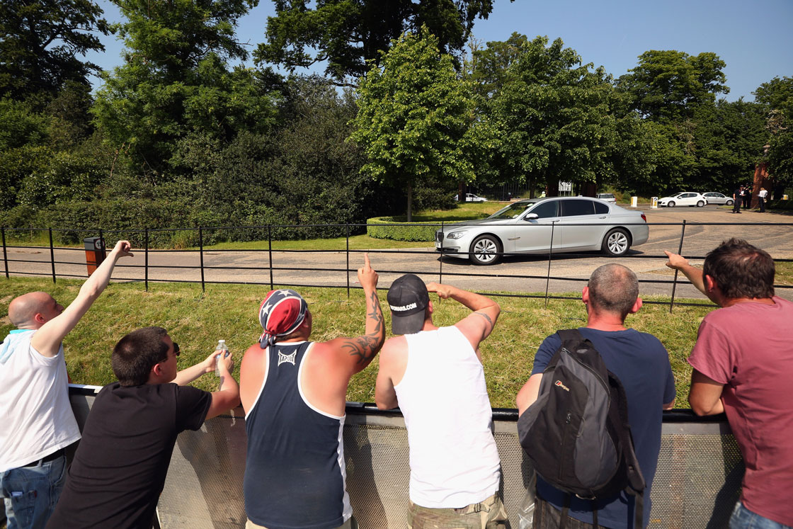 Protesters greet attendees in Hertfordshire, United Kingdom.