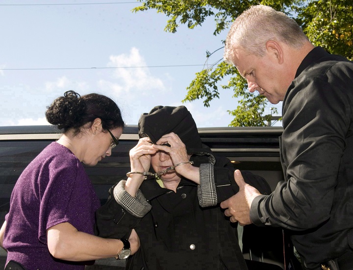 Melissa Ann Shepard, also known as the "Black Widow," leaves a Cape Breton Regional Police Services vehicle for a court appearance at the Sydney Justice Centre, Tuesday, Oct.2, 2012. 