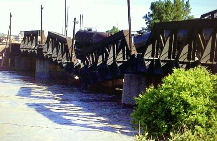 An image from the June 2013 bridge failure and derailment of the Bonnybrook Bridge following historic flooding.