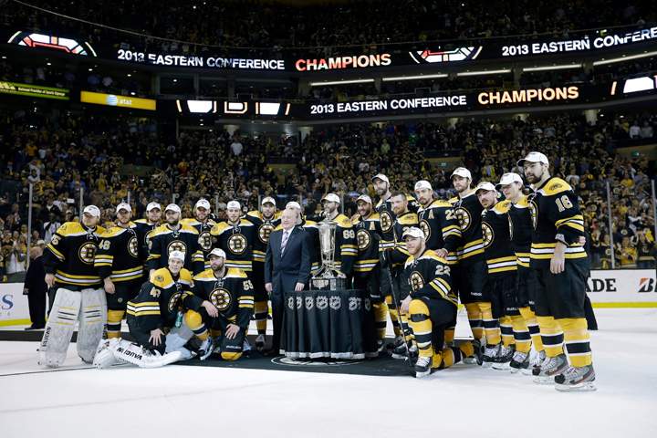 The Boston Bruins pose with the trophy after beating the Pittsburgh Penguins 1-0 in Game 4 of the Eastern Conference finals of the NHL hockey Stanley Cup playoffs, in Boston on Friday, June 7, 2013. 