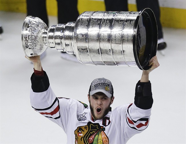 Chicago Blackhawks' Jonathan Toews hoists the Stanley Cup in June 2013. Who's your favourite Manitoba NHL player?.