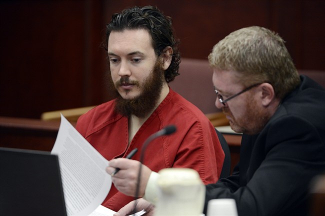 Defense Attorney Daniel King, right, and Aurora theater shooting suspect James Holmes review advisement documents in court in Centennial, Colo., on Tuesday, June 4, 2013.