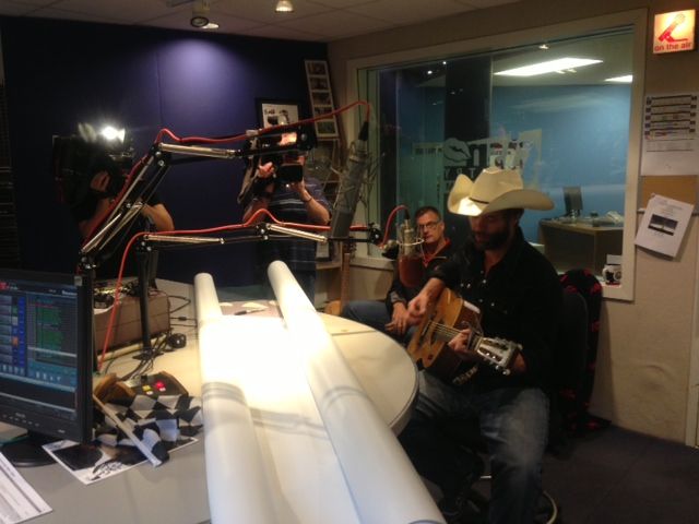 Canadian country singer Corb Lund, from Alberta, with the banner that the Eskimos want people to sign.