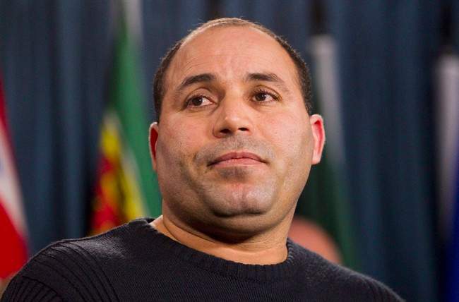 Mohamed Harkat pauses during a press conference on Parliament Hill marking the 10th anniversary of his arrest and detention on a security certificate, Monday, Dec. 10, 2012 in Ottawa.