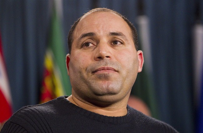 Mohamed Harkat pauses during a press conference on Parliament Hill marking the 10th anniversary of his arrest and detention on a security certificate, Monday, Dec. 10, 2012 in Ottawa.