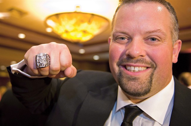 B.C. Lions Angus Reid shows off his 2011 Grey Cup ring in Richmond, B.C., on June 1, 2012.