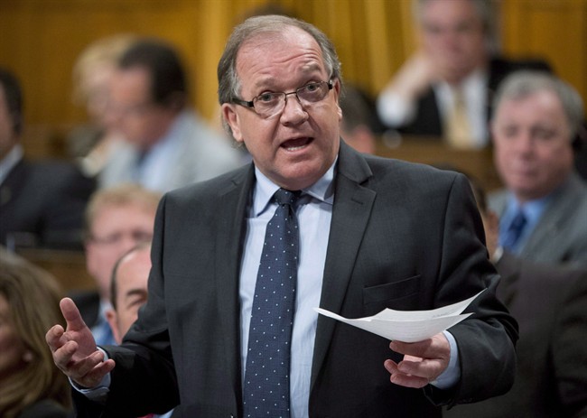 Aboriginal Affairs Minister Bernard Valcourt responds to a question during question period in the House of Commons Tuesday May 28, 2013 in Ottawa.