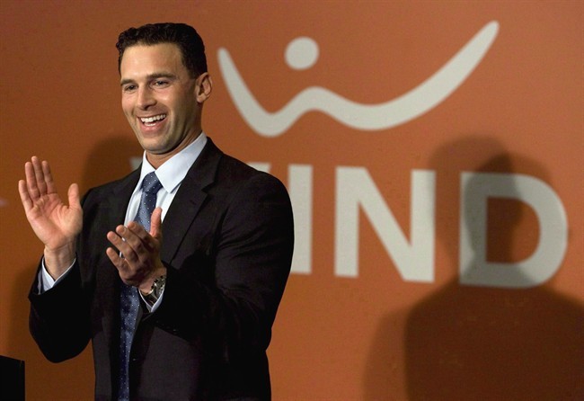 Globalive and WIND Mobile chairman Anthony Lacavera claps during a press conference in Toronto on December 11, 2009. 