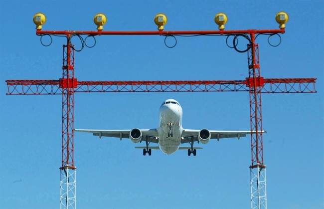 An airliner prepares to land at Pearson International Airport in Toronto,.